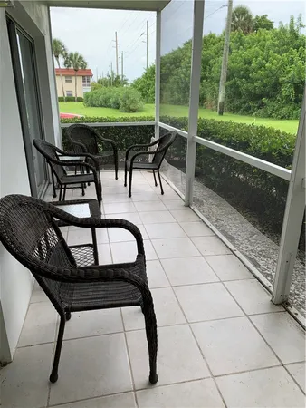 a view of a chairs and table in the patio