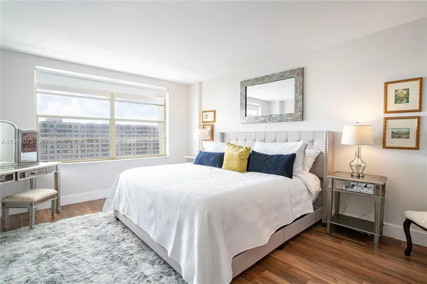 a bedroom with a bed and a table