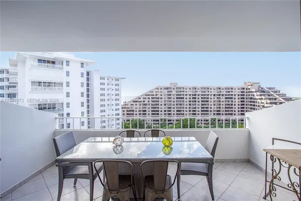 a view of a dining room with furniture and window
