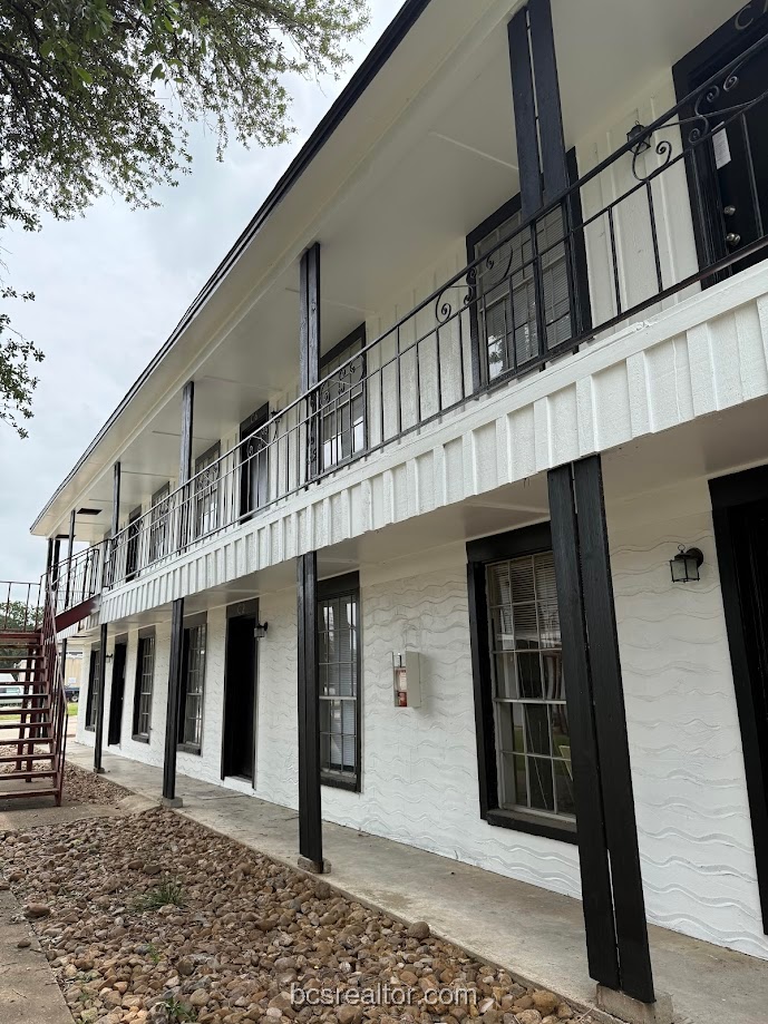 3300 South College Avenue, Unit B4 Bryan, TX 77801 - Photo 1 of 1 View of building exterior with stairs