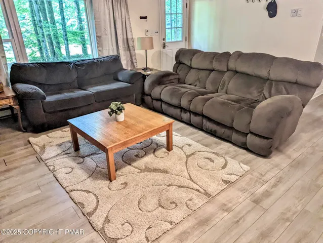 a living room with a couch and a dresser