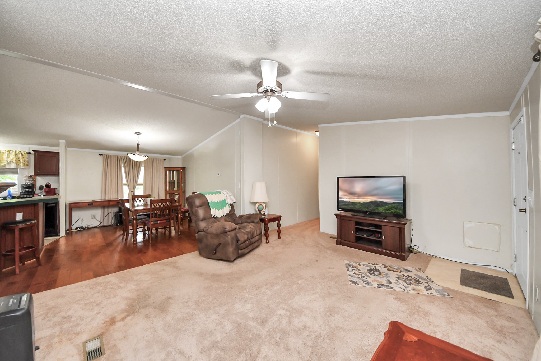 204 Edith Street Highlands, TX 77562 - Photo 7 of 33 a view of a livingroom with furniture flat screen tv and couches