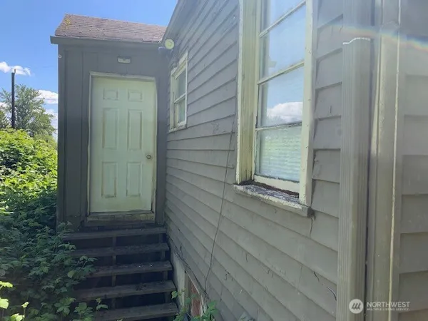 a room with cabinets and a refrigerator