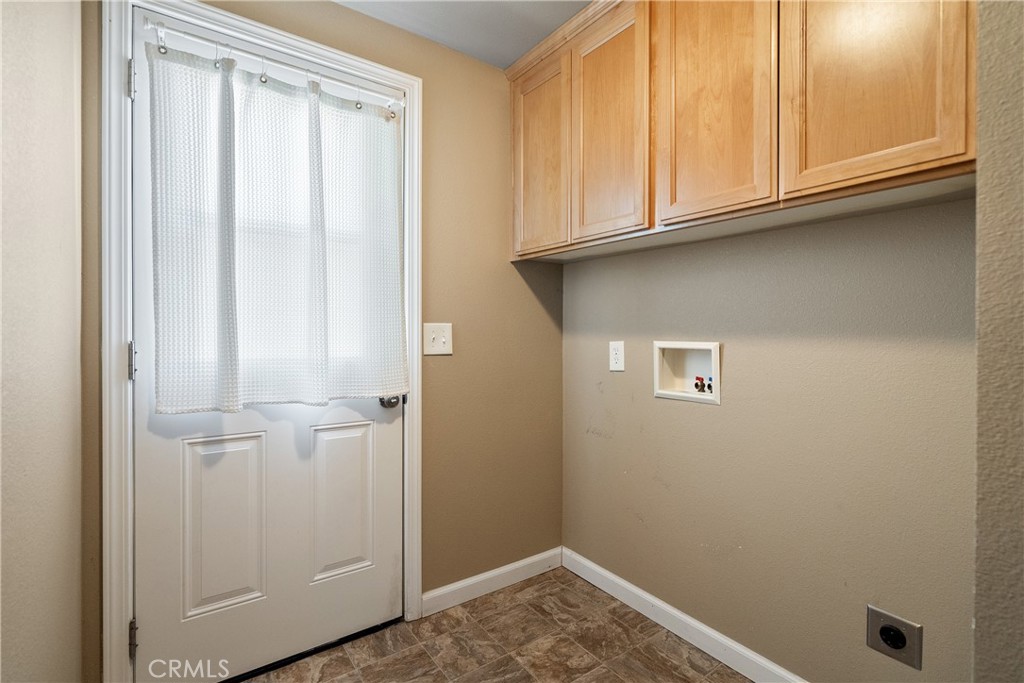 1220 Bennett Way, Unit 2 Templeton, CA 93465 - Photo 27 of 43 Separate laundry room offers more cabinetry and rear access door, conveniently located close to the garage