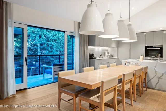 a view of a dining room with furniture window and outside view