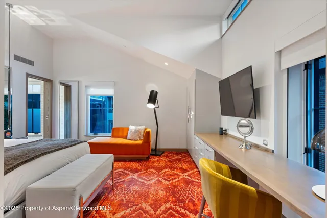 a bedroom with bed and walk in closet