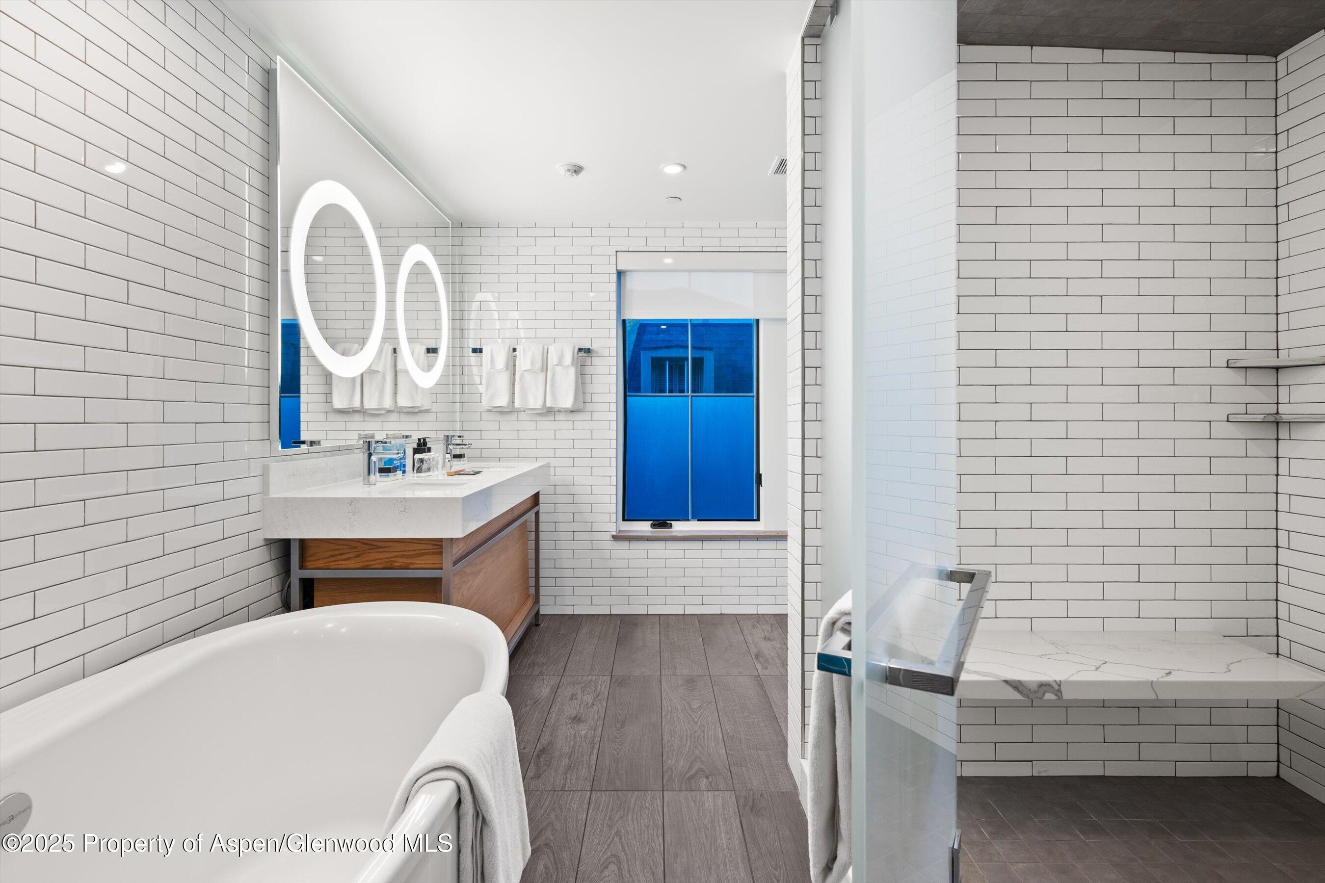550 South Spring Street, Unit F10 110 Aspen, CO 81611 - Photo 27 of 58 a bathroom with a sink a toilet and shower