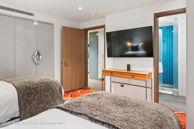 a bathroom with a shower and toilet