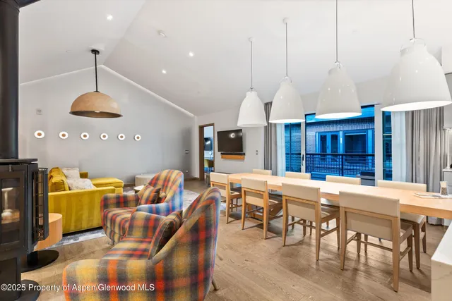 a dining room with furniture and window