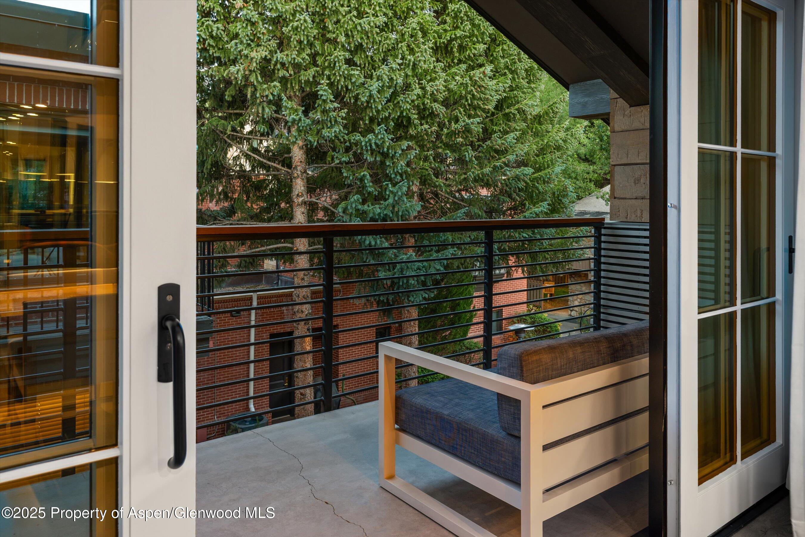 550 South Spring Street, Unit F10 110 Aspen, CO 81611 - Photo 41 of 58 a view of a balcony with chairs