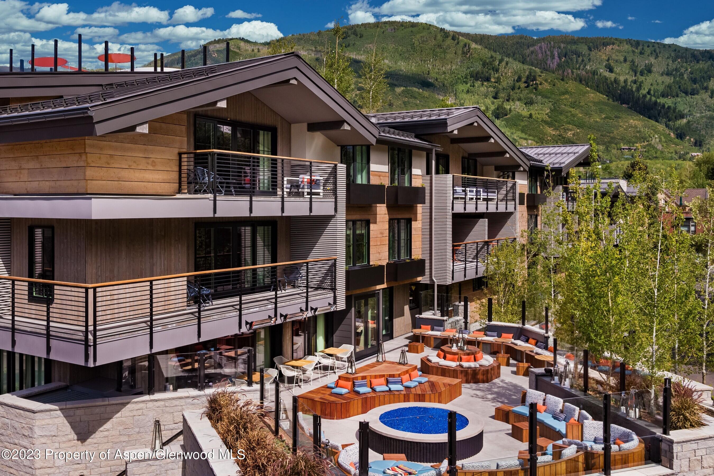 550 South Spring Street, Unit F10 110 Aspen, CO 81611 - Photo 47 of 58 a view of a chairs and table in the terrace
