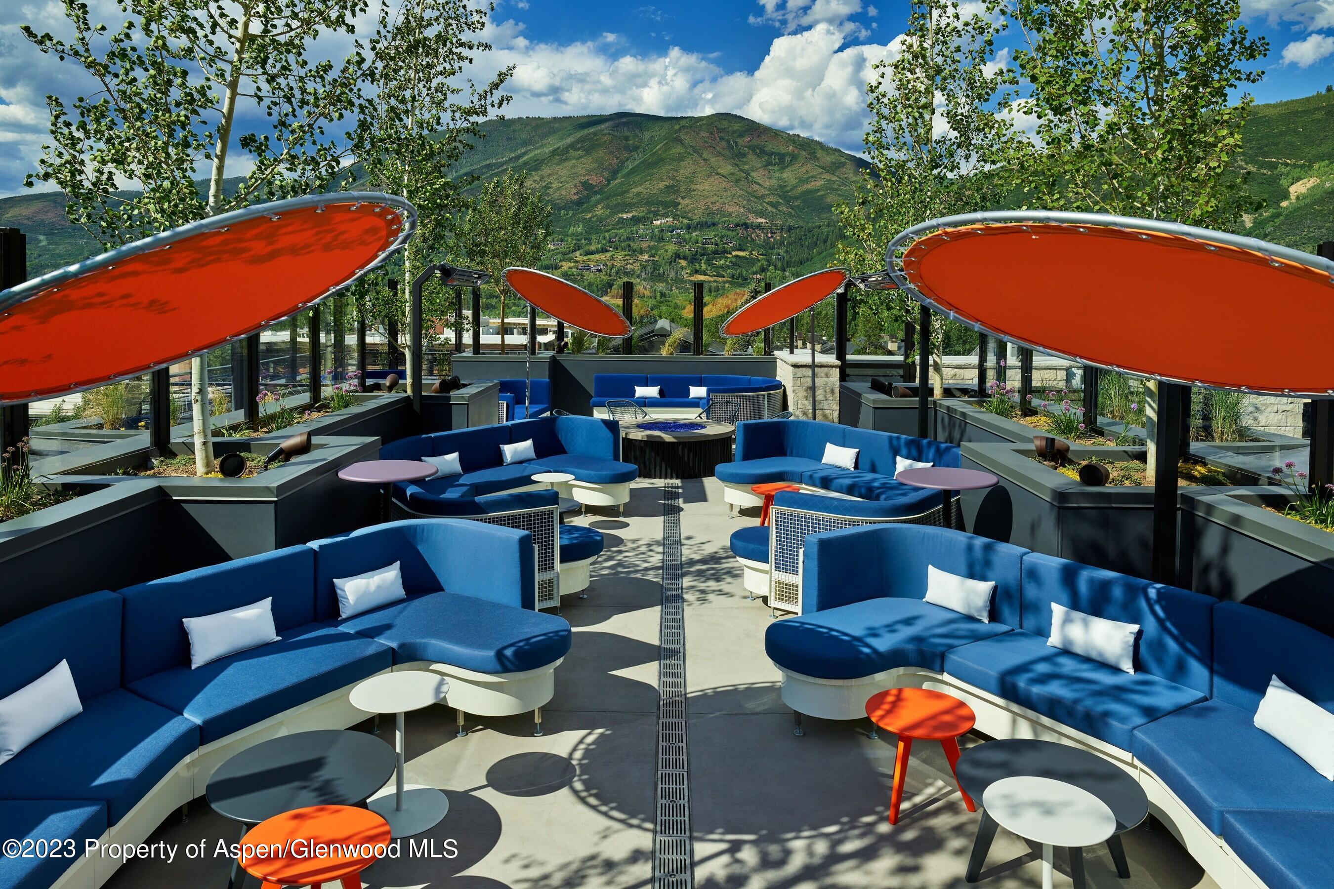 550 South Spring Street, Unit F10 110 Aspen, CO 81611 - Photo 52 of 58 a front view of a house with swimming pool outdoor seating