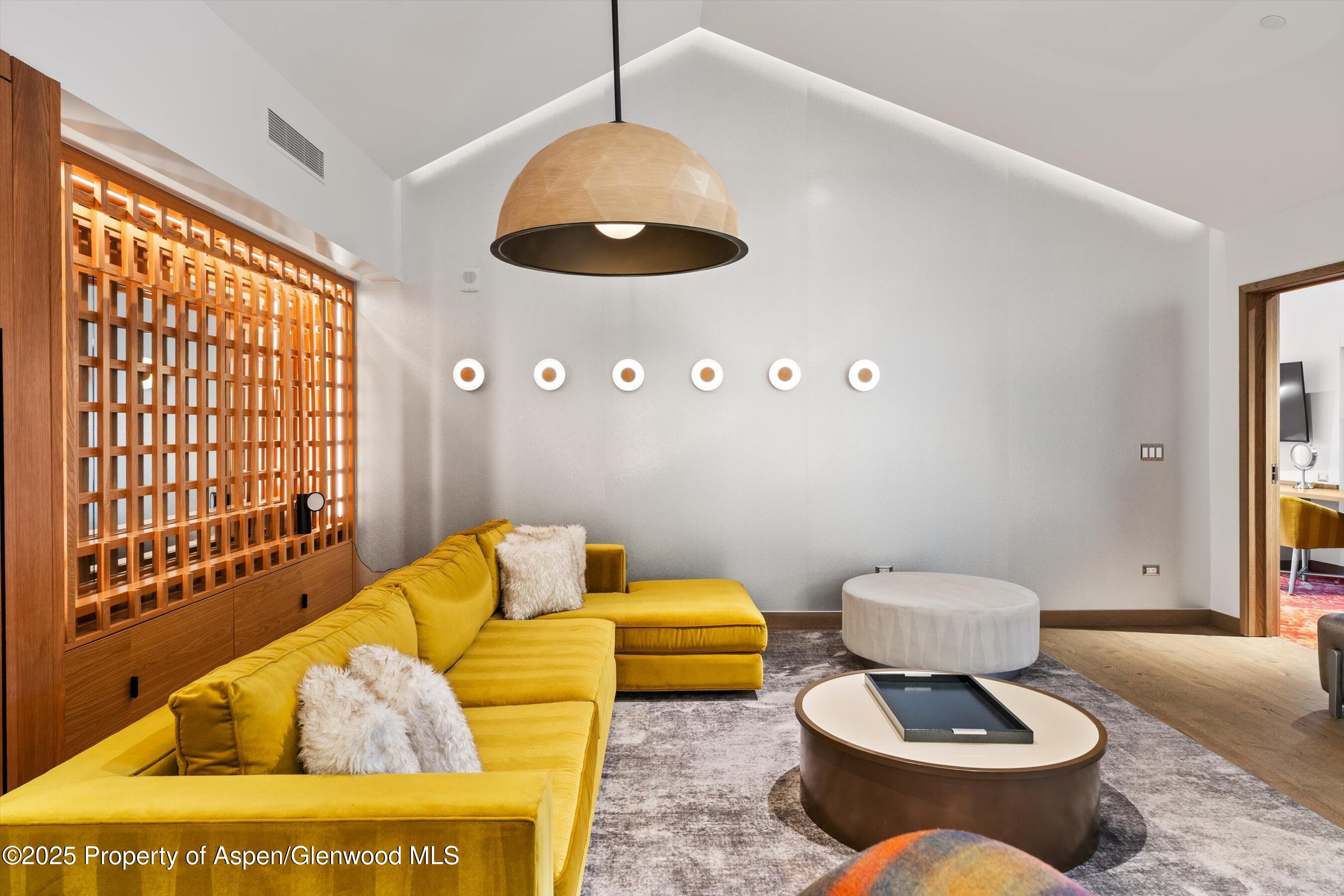 550 South Spring Street, Unit F10 110 Aspen, CO 81611 - Photo 6 of 58 a living room with furniture and a large window