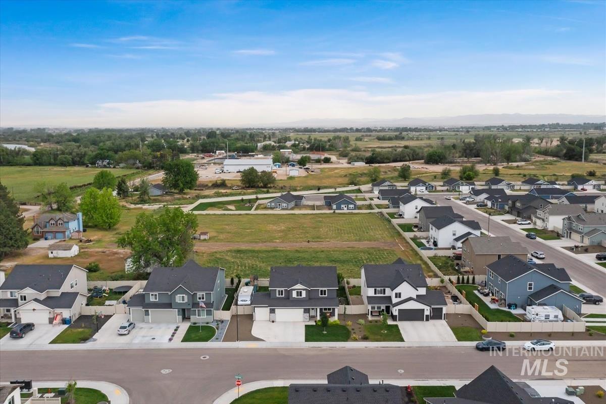 815 Knowledge Street Middleton, ID 83644 - Photo 4 of 49 Aerial perspective showcasing a residential development with varied housing styles