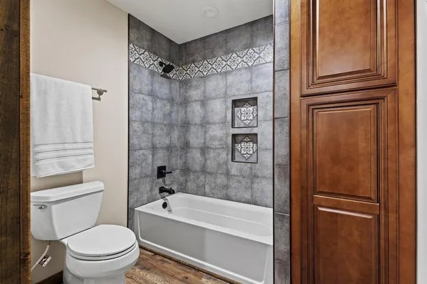 a spacious bathroom with a granite countertop sink and a mirror