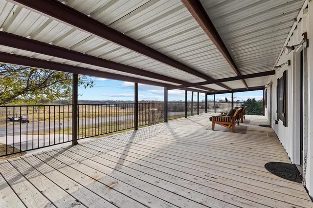 a spacious bathroom with a granite countertop sink mirror and shower