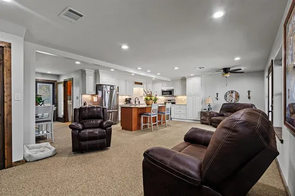 a living room with furniture and a large window