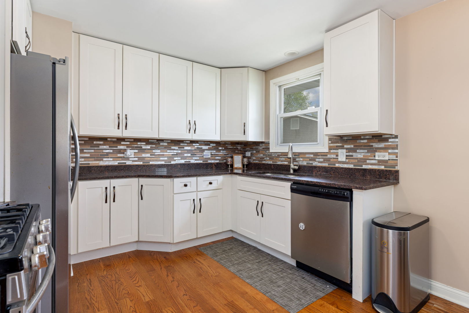 575 Aztec Drive Carol Stream, IL 60188 - Photo 8 of 20 a kitchen with stainless steel appliances granite countertop a stove a sink and a refrigerator