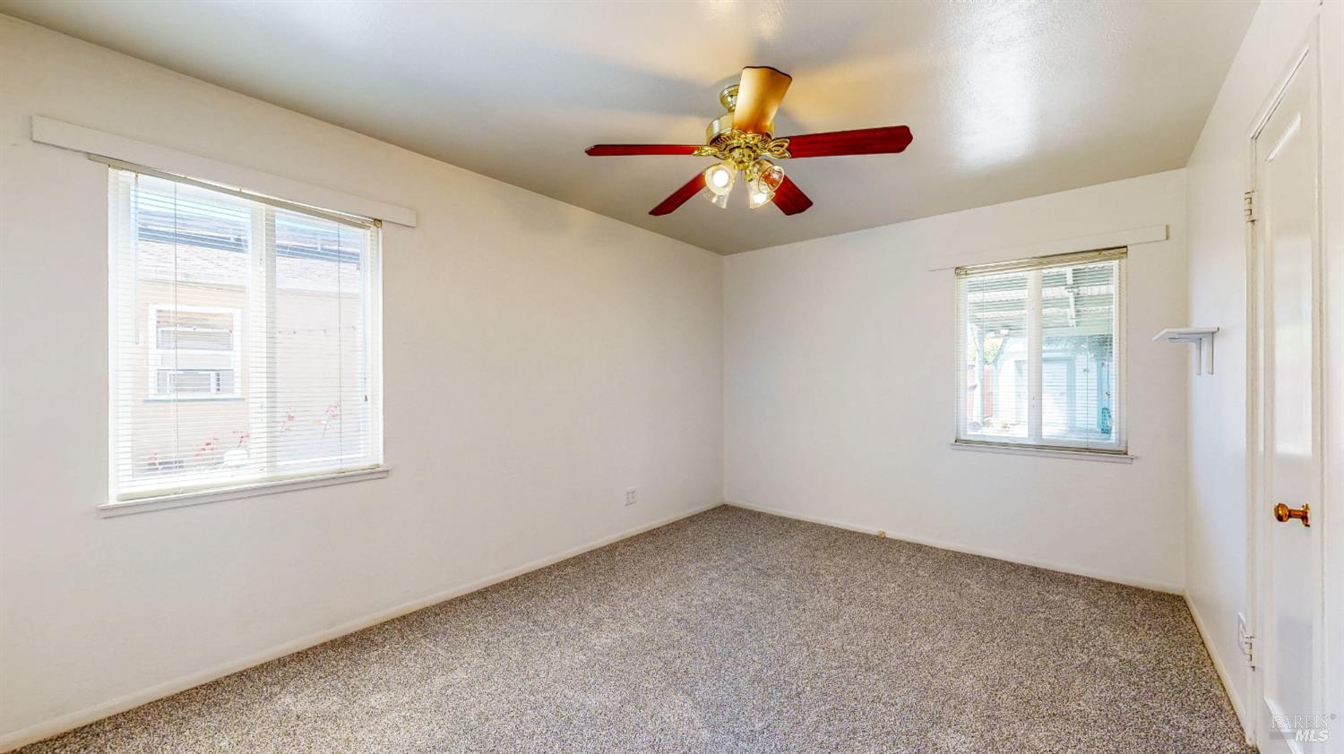 809 Maple Avenue Vallejo, CA 94591 - Photo 28 of 46 a view of an empty room with window and chandelier fan