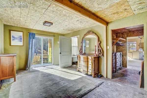 a view of a hall with wooden floor