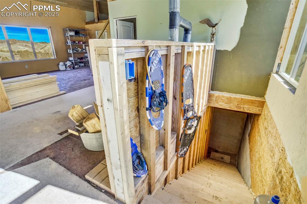 1440 Range Road Guffey, CO 80820 - Photo 33 of 50 a view of walk in closet with clothes and shoes