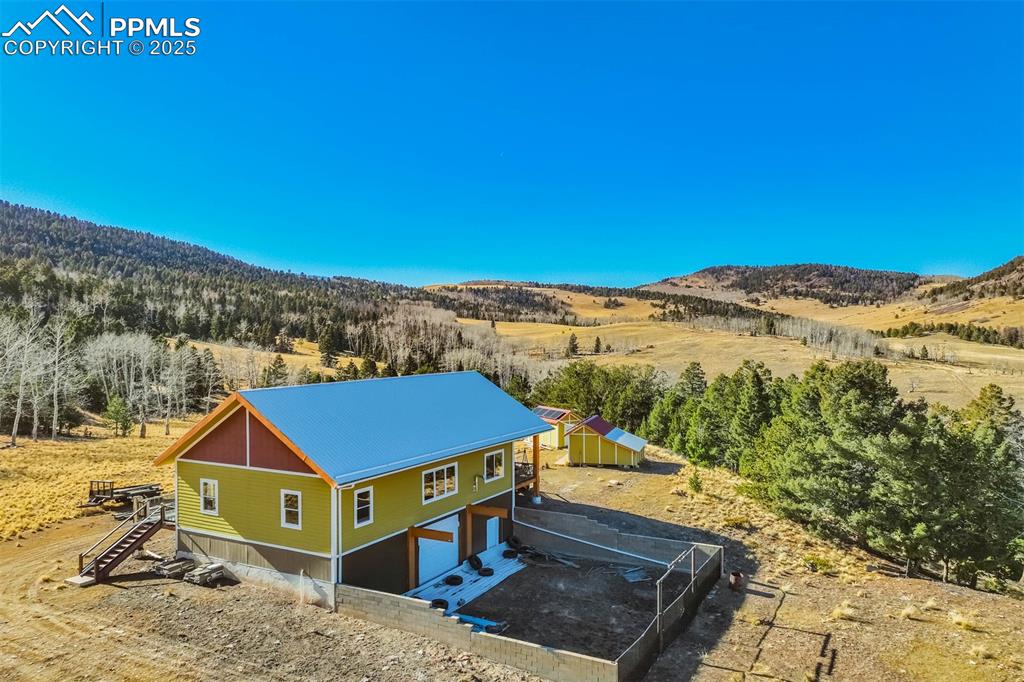 1440 Range Road Guffey, CO 80820 - Photo 7 of 50 a view of a house with a yard