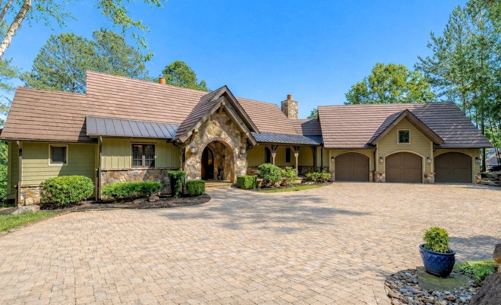 215 Long Ridge Road Sunset, SC 29685 - Photo 2 of 50 This charming home offers a sprawling paver driveway, an inviting entrance, and an attached three-car garage.