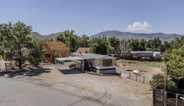 a view of multiple houses with a yard