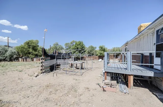 a view of a dinning table and chairs in the patio