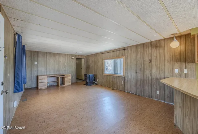 a view of a room with furniture and window