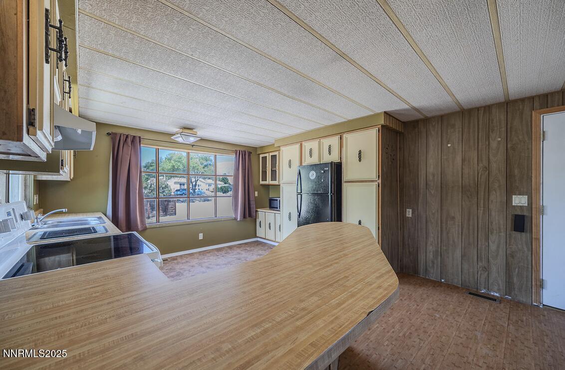 17530 Thrush Lane Reno, NV 89508 - Photo 6 of 25 a bedroom with a bed and a chandelier