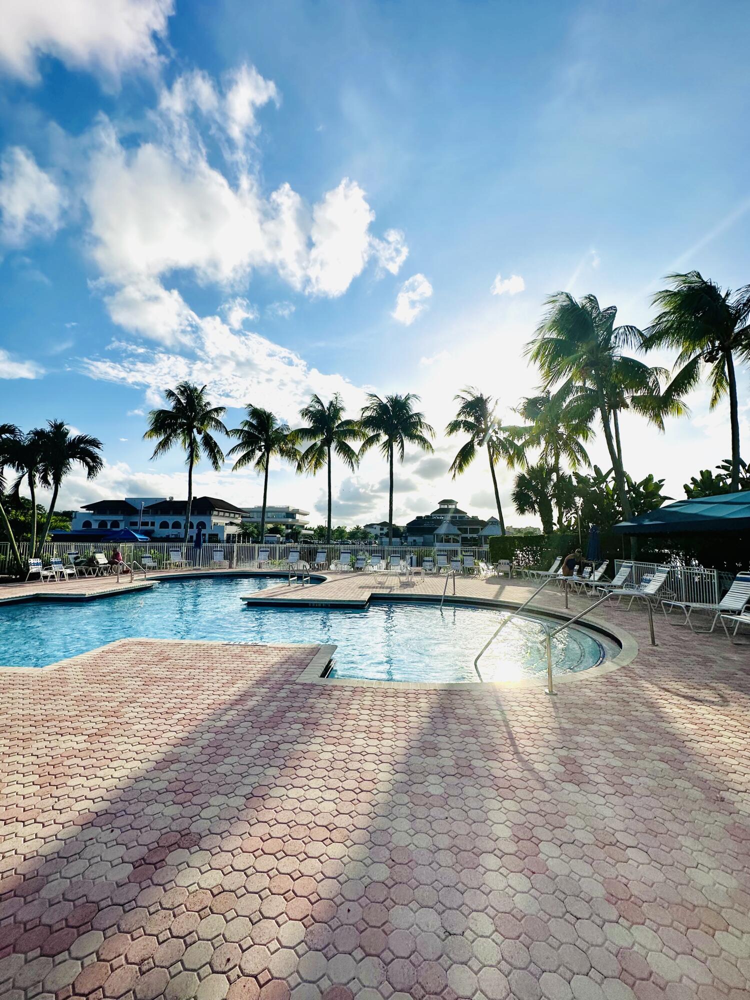 6663 Via Regina Boca Raton, FL 33433 - Photo 15 of 16 a view of outdoor space with swimming pool and lounge chair