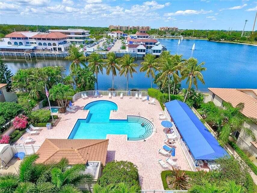 6663 Via Regina Boca Raton, FL 33433 - Photo 16 of 16 an aerial view of a house with a garden and lake view