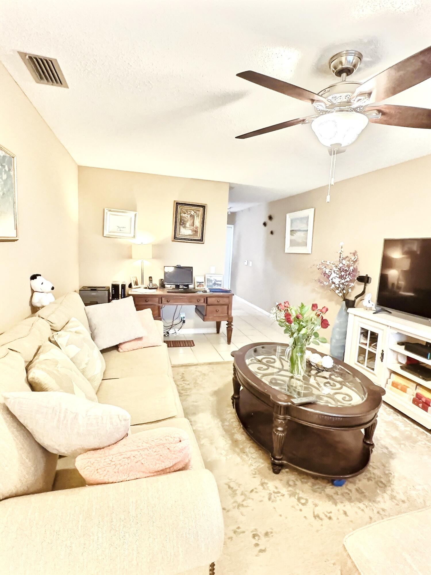 6663 Via Regina Boca Raton, FL 33433 - Photo 3 of 16 a living room with furniture and a wooden floor