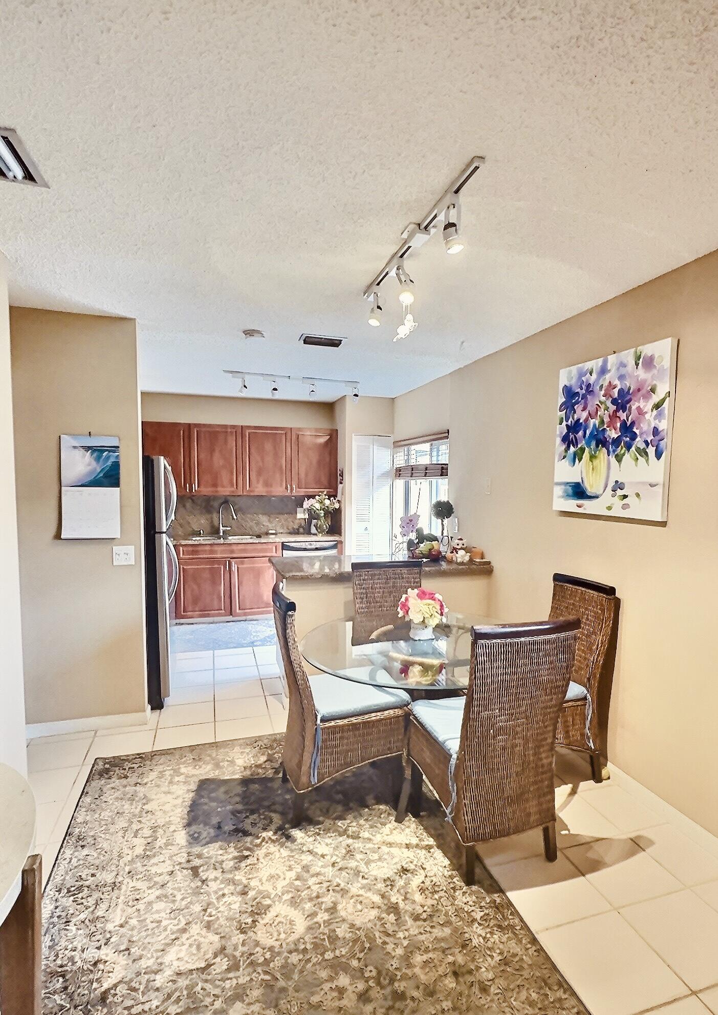 6663 Via Regina Boca Raton, FL 33433 - Photo 4 of 16 a living room with a couch and a coffee table