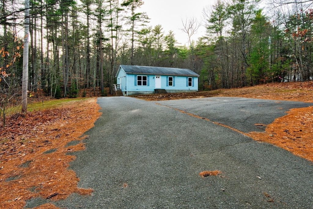 70 Ashburnham State Road Westminster, MA 01473 - Photo 1 of 32 a front view of a house with a yard and trees