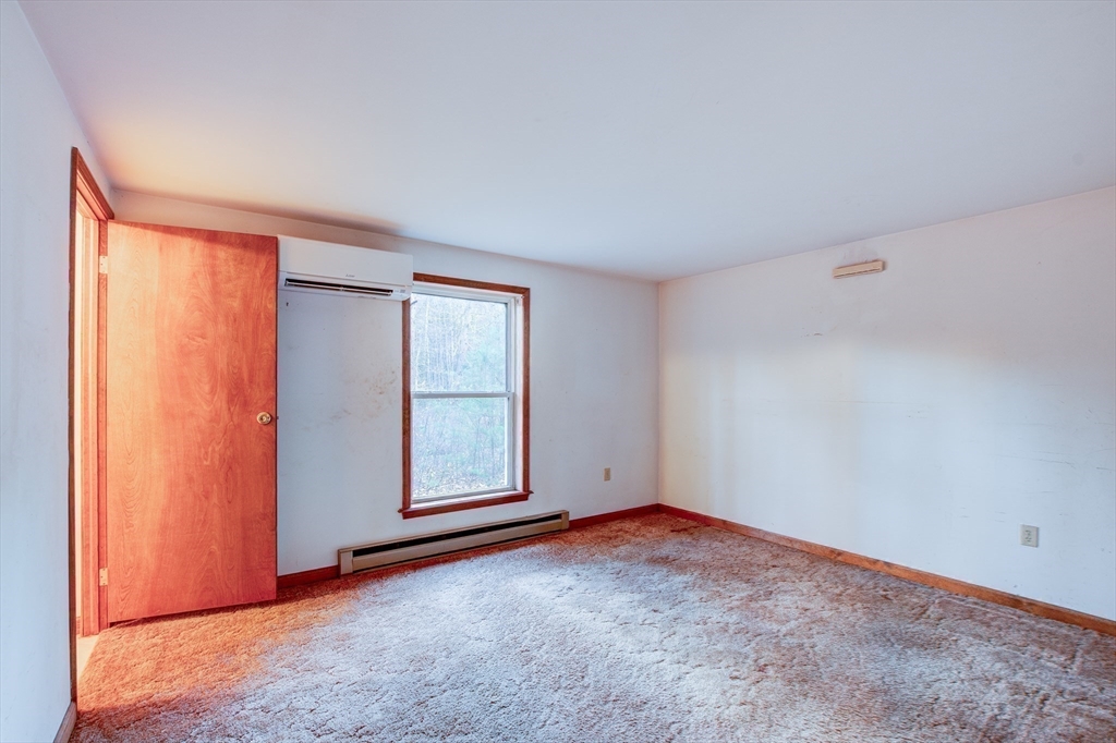 70 Ashburnham State Road Westminster, MA 01473 - Photo 21 of 32 an empty room with windows and closet