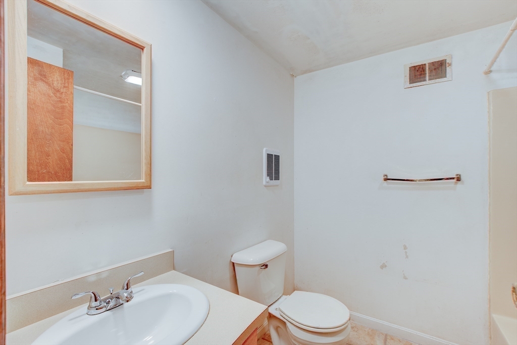 70 Ashburnham State Road Westminster, MA 01473 - Photo 22 of 32 a white toilet sitting next to a bathroom sink