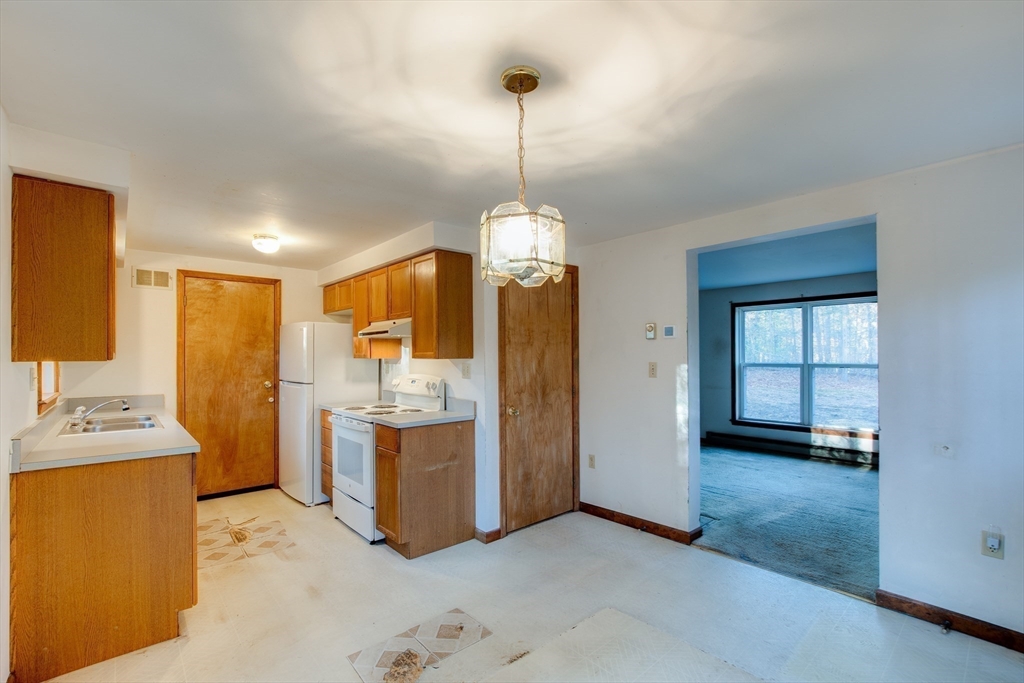 70 Ashburnham State Road Westminster, MA 01473 - Photo 4 of 32 a view of a kitchen with refrigerator and window