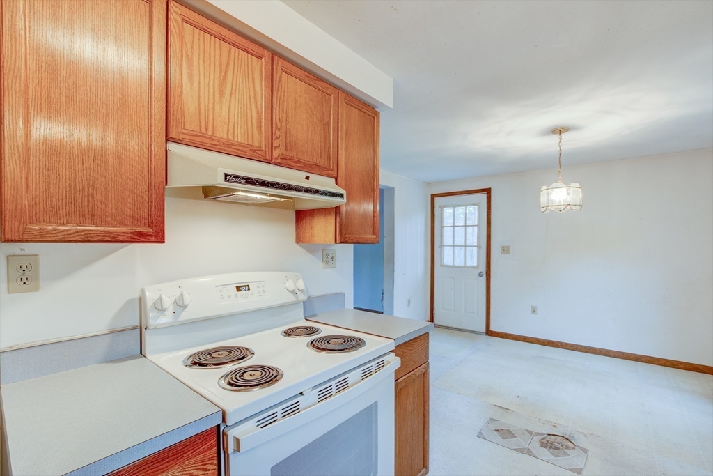 70 Ashburnham State Road Westminster, MA 01473 - Photo 6 of 32 a kitchen with a stove and a refrigerator