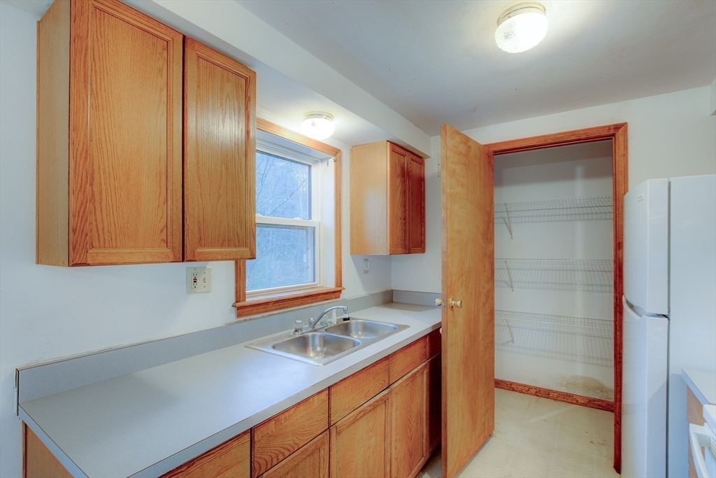 70 Ashburnham State Road Westminster, MA 01473 - Photo 8 of 32 a kitchen with a sink cabinets and wooden floor