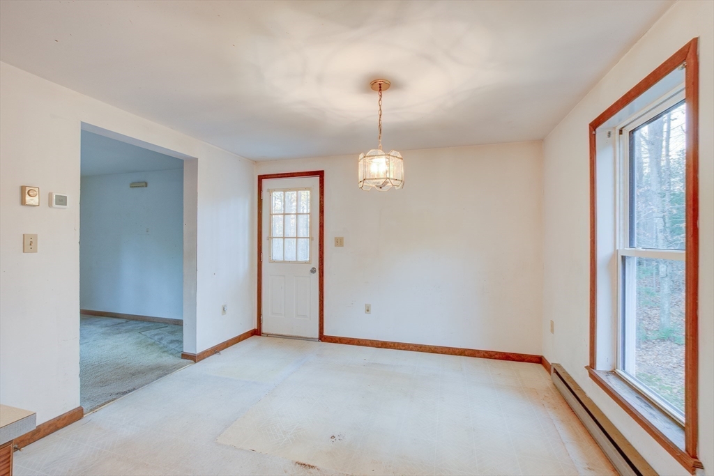 70 Ashburnham State Road Westminster, MA 01473 - Photo 10 of 32 a view of an empty room with window and chandelier fan