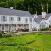 a aerial view of a house with a yard patio and swimming pool