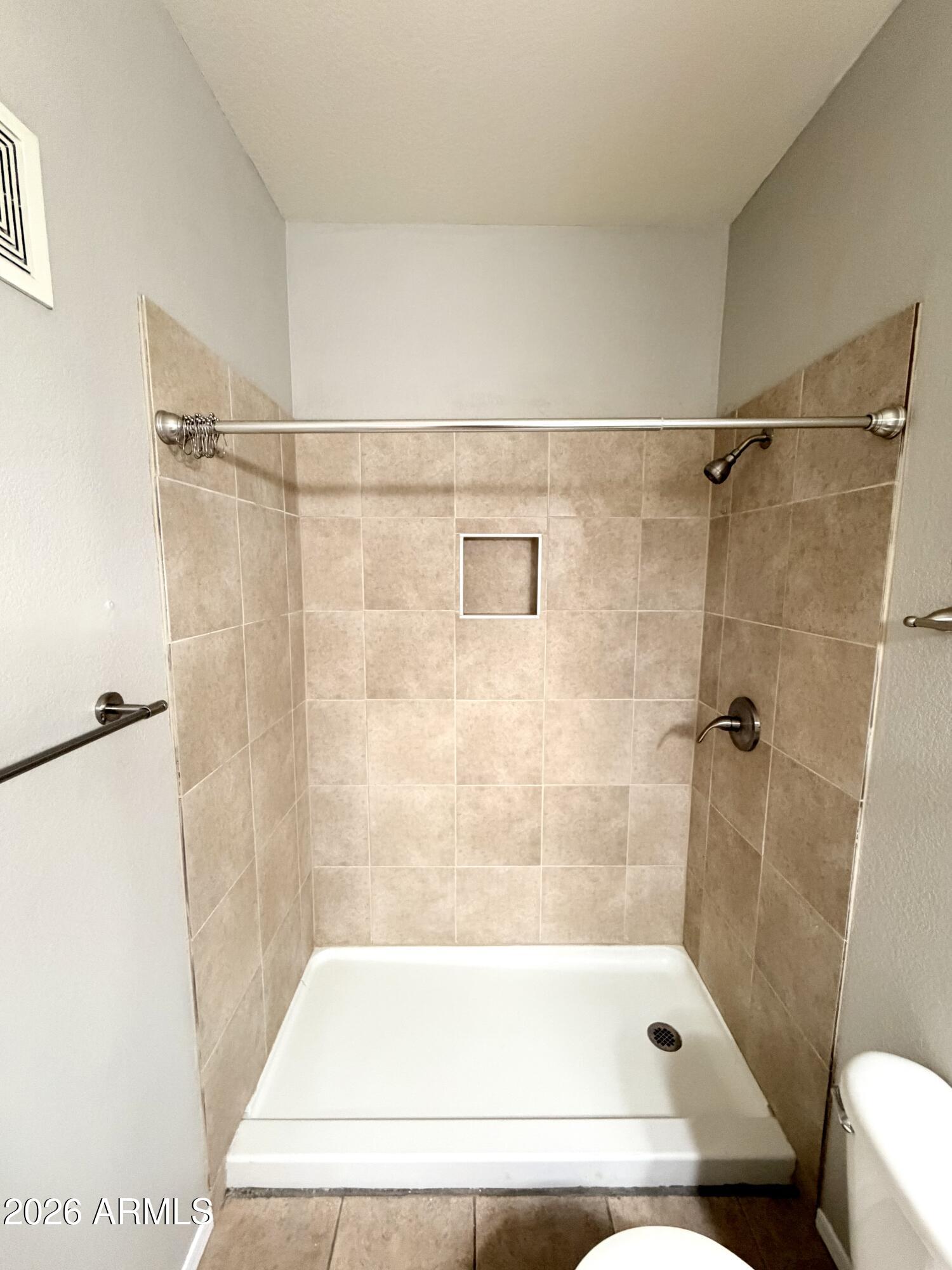 3434 East Baseline Road, Unit 165 Phoenix, AZ 85042 - Photo 11 of 12 a bathroom with a shower and a bath tub