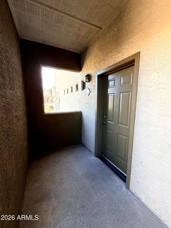 a view of an empty room with a window