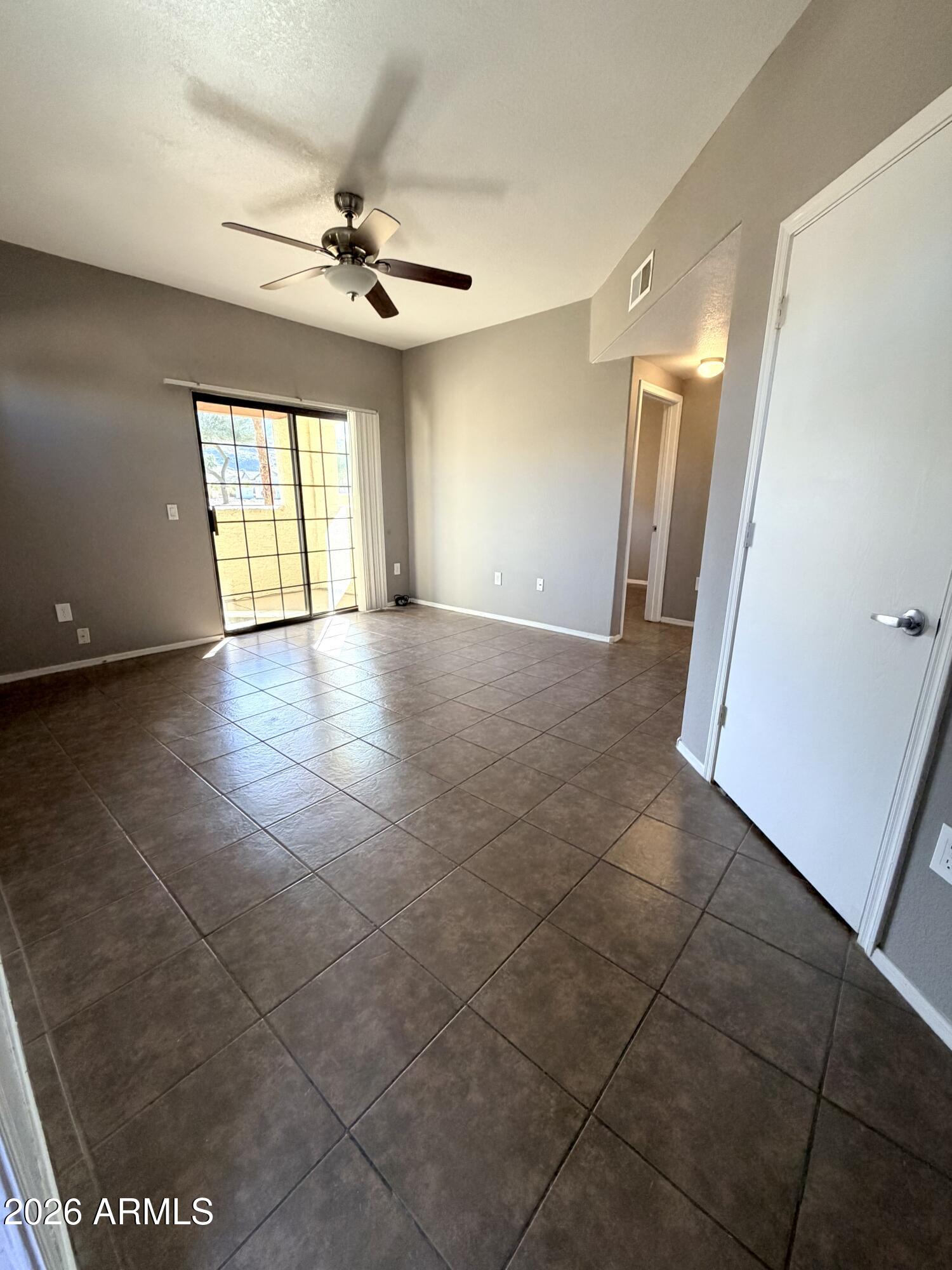 3434 East Baseline Road, Unit 165 Phoenix, AZ 85042 - Photo 3 of 12 a view of an empty room with a window