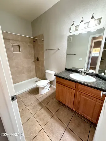 a bathroom with a shower and a bath tub