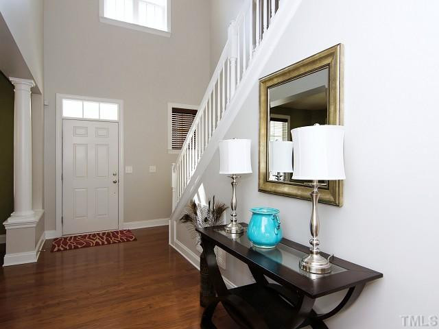 13002 Edsel Drive Raleigh, NC 27613 - Photo 2 of 24 Foyer with cathedral ceiling and chandelier, and transom window over front door. Foyer