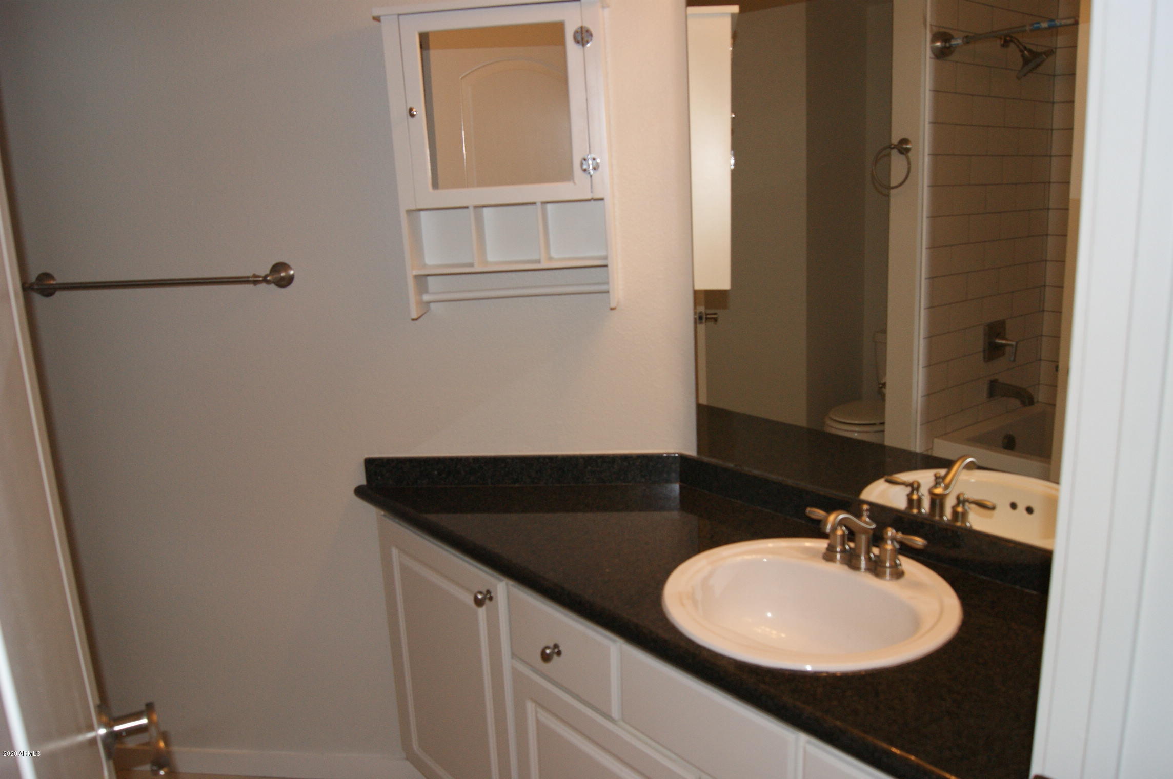 3633 North 3rd Avenue, Unit 1060 Phoenix, AZ 85013 - Photo 16 of 23 a bathroom with a sink and a mirror