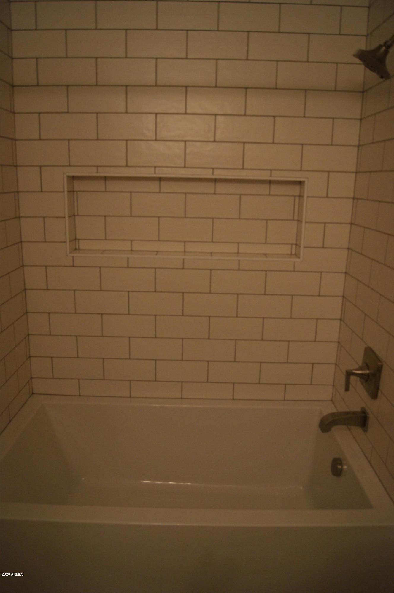 3633 North 3rd Avenue, Unit 1060 Phoenix, AZ 85013 - Photo 17 of 23 a bathroom with a bathtub